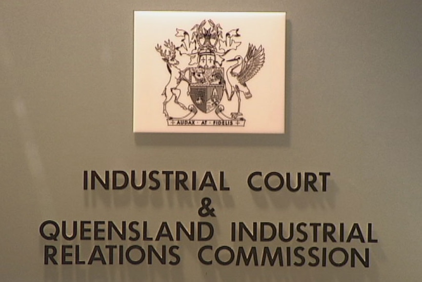 A sign with the Queensland coat of arms saying Industrial Court and Queensland Industrial Relations Commission.