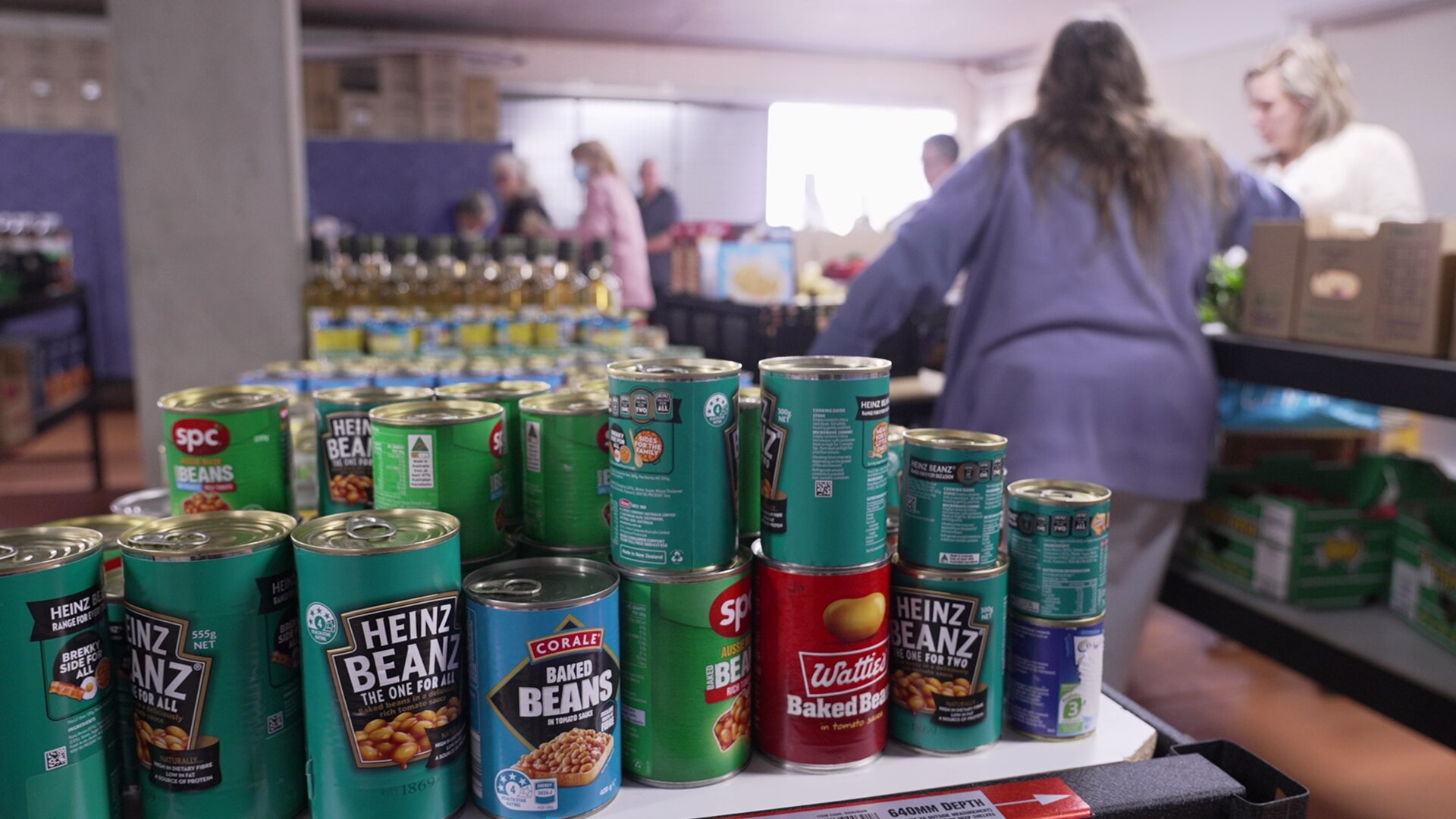 Cans of baked beans at the Ipswich Assist Restore charity grocery store