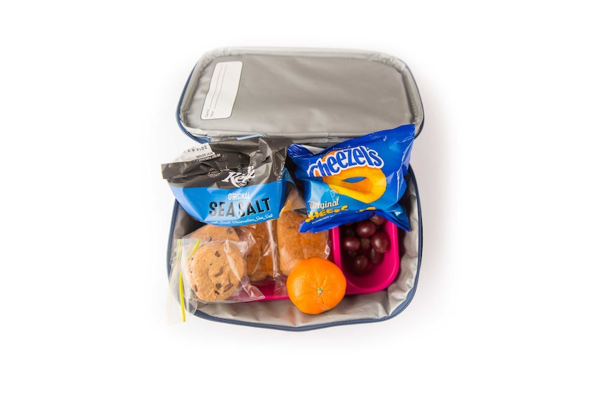 A Nutella roll, choc chip cookies, Cheezels, sea salt potato chips, grapes and a mandarin in a cooler bag.