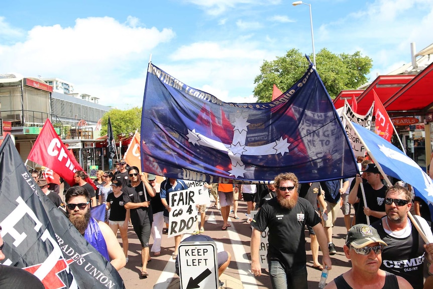 Workers rally through Darwin streets to protest work practices on the JKC-managed INPEX LNG site.