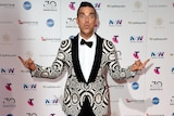 Singer Robbie Williams poses in front of the camera at the Star casino in Sydney for the ARIA Awards.