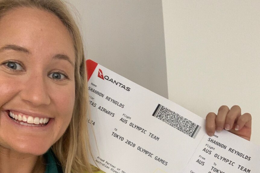 Kayaker Shannon Reynolds with her Qantas ticket to the Tokyo Olympic games
