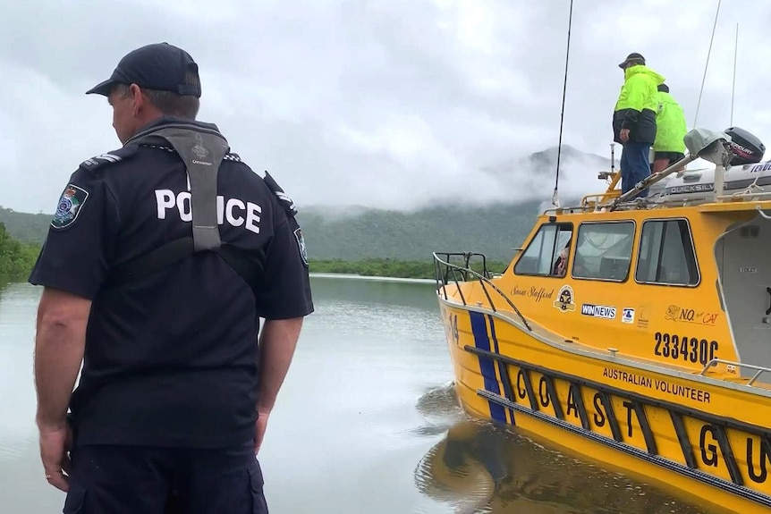 Police and Coast Guard volunteers searching a waterway