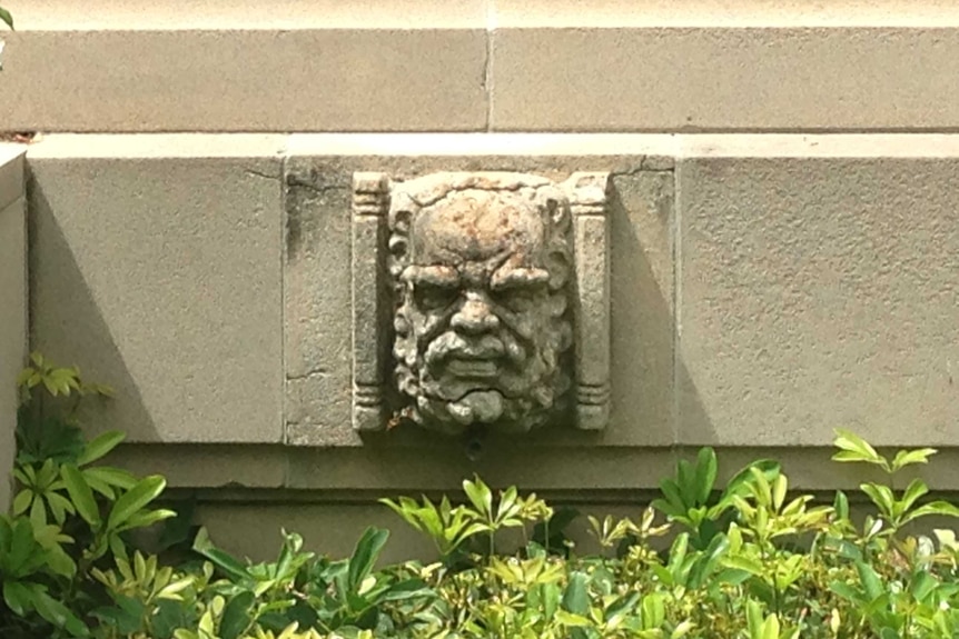 A gargoyle depicting an Aboriginal man at the Australian War Memorial.