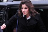 UNITED KINGDOM, London : British television chef Nigella Lawson arrives at Isleworth Crown Court in west London, on December 4, 2013, as she prepares to give evidence in a case in which her two personal assistants (Elisabetta and Francesca Grillo) are accused of defrauding her and former husband Charles Saatchi. AFP PHOTO / CARL COURT