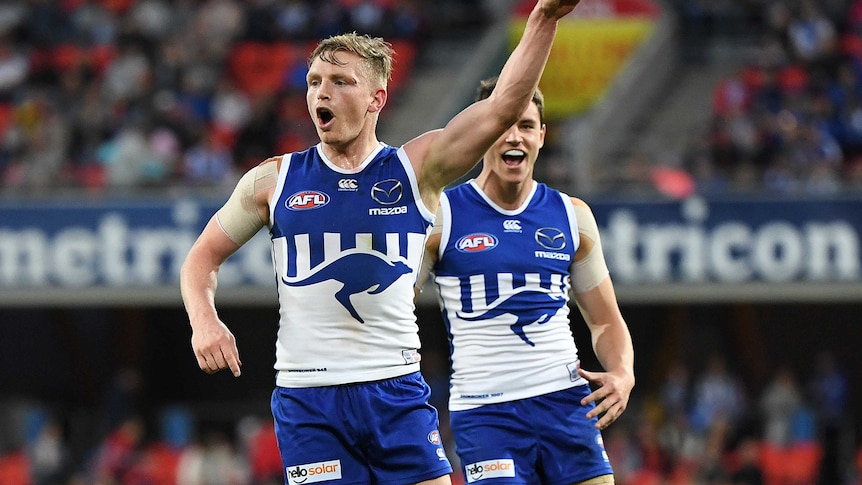 Jack Ziebell yells and points his finger towards the crowd in celebration of a goal.