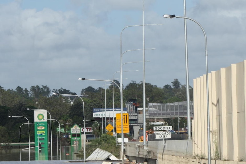 Floodwaters alongside the Ipswich Motorway at the Goodna turn-off, west of Brisbane on January 13, 2011.