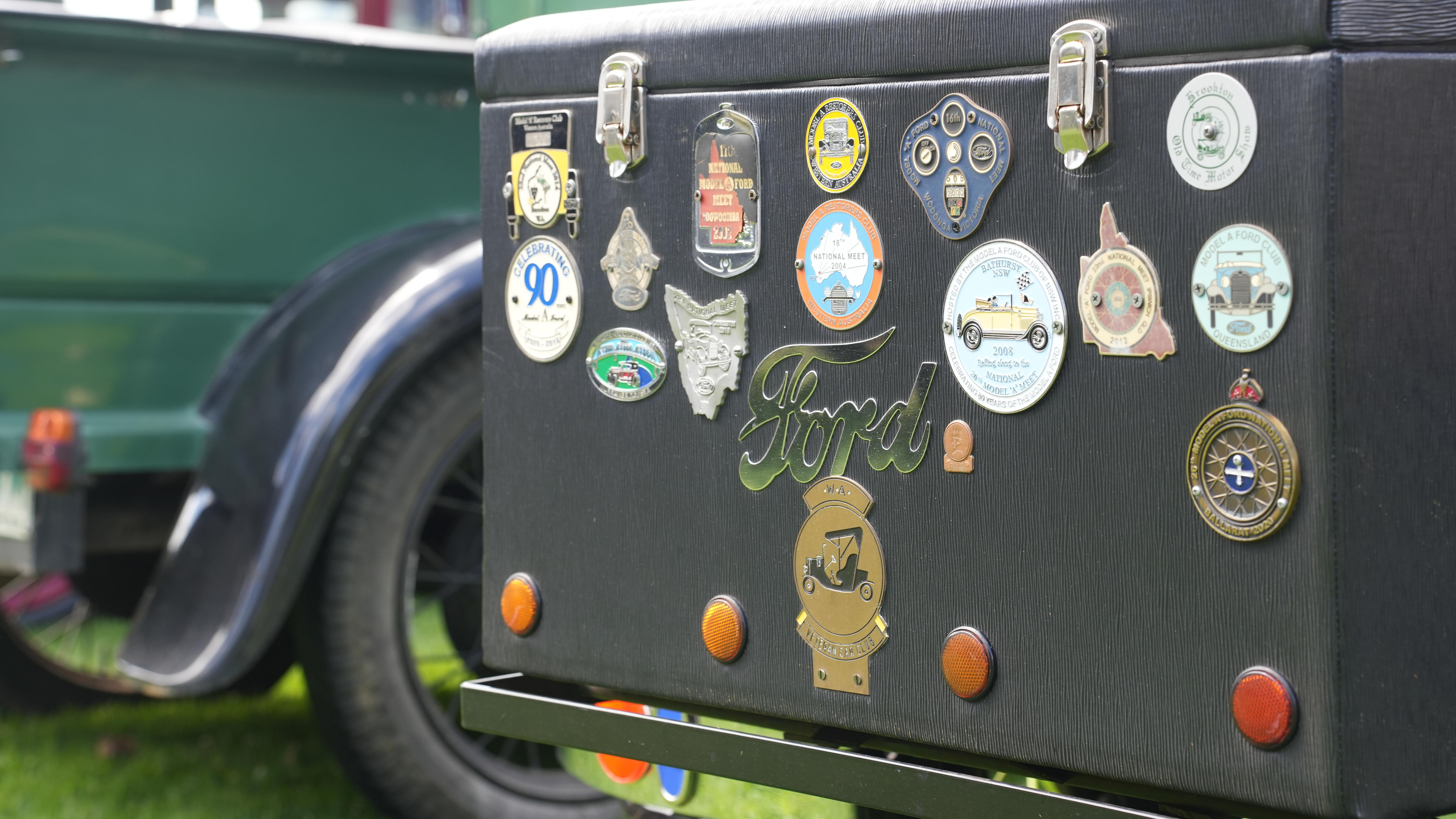 a ford badge on a suitcase