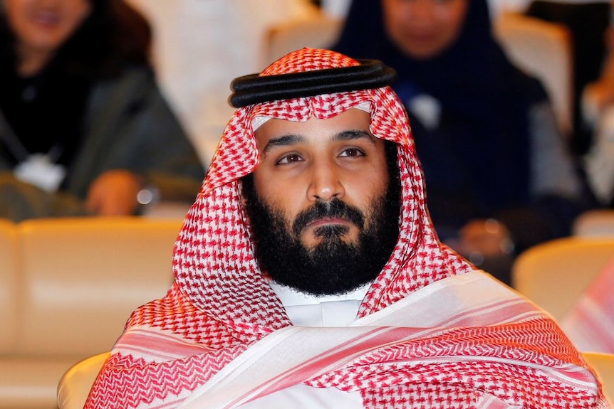 Saudi Crown Prince Mohammed bin Salman sits in the audience of the Future Investment Initiative conference.