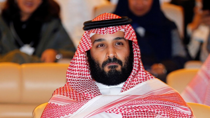 Saudi Crown Prince Mohammed bin Salman sits in the audience of the Future Investment Initiative conference.