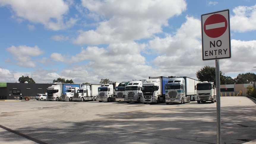 A line of trucks at a stop