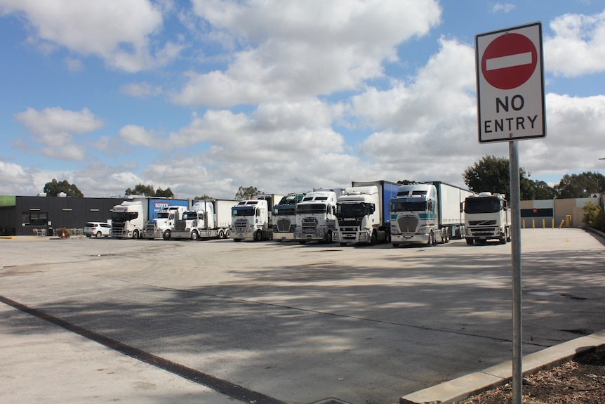 A line of trucks at a stop