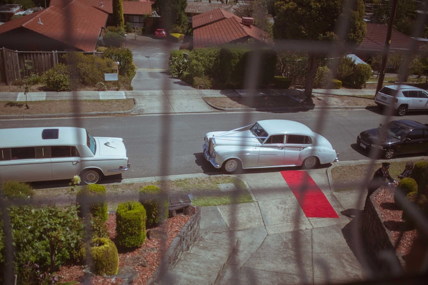 A limousine and car wait at the front of Eleni's Lower Templestowe home.