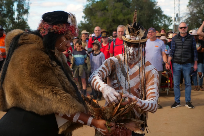 A woman and a man in traditional dress.