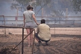 Two people in bushfire smoke