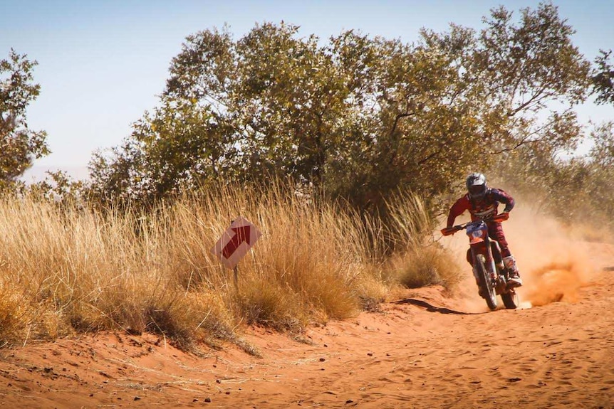 A man participates in Finke Desert Race.