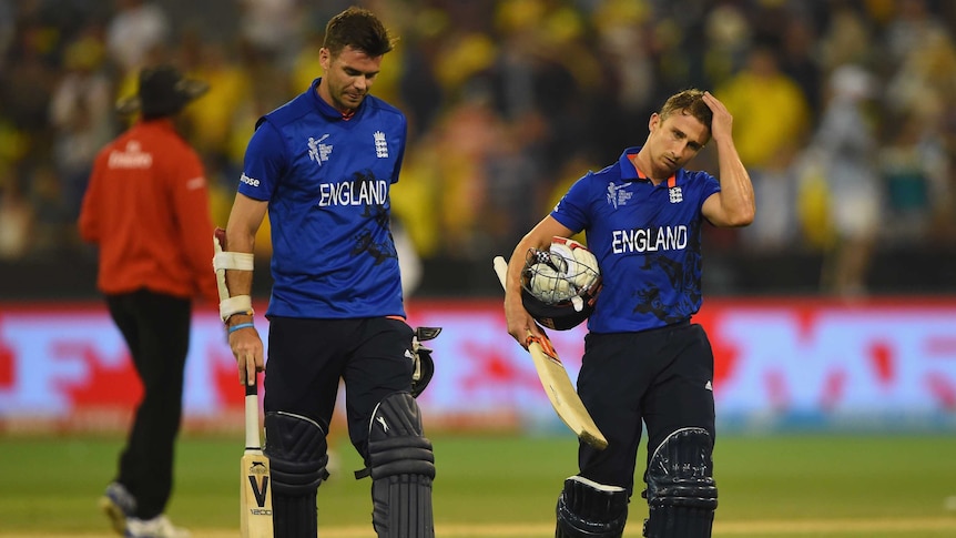 James Anderson (L) and James Taylor walk off after England's Cricket World Cup loss to Australia.