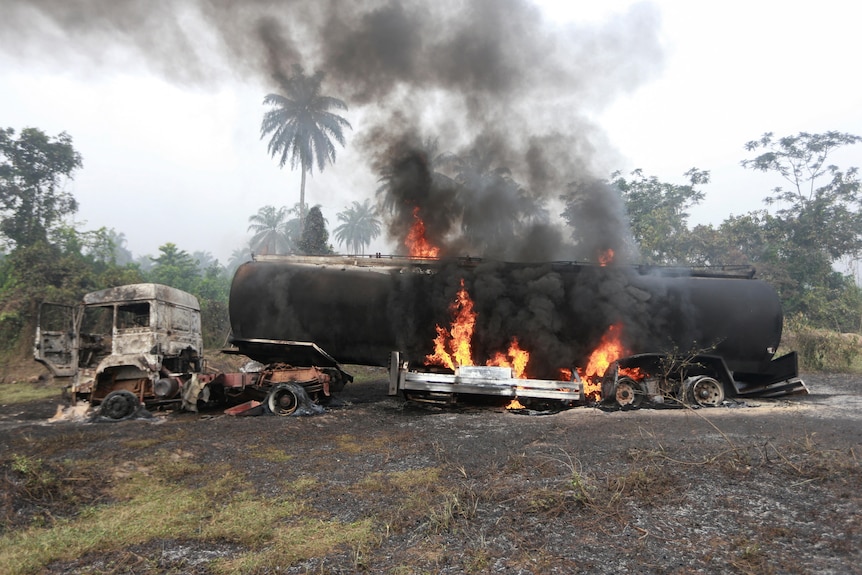 A tanker truck laden with stolen refined petroleum product is seen after it was set ablaze.