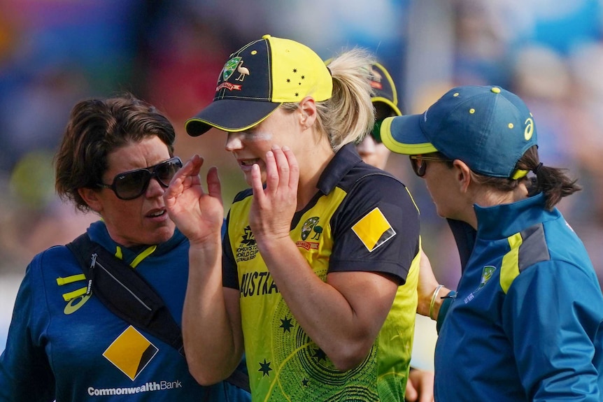 Ellyse Perry walks off in tears with her hands either side of her head