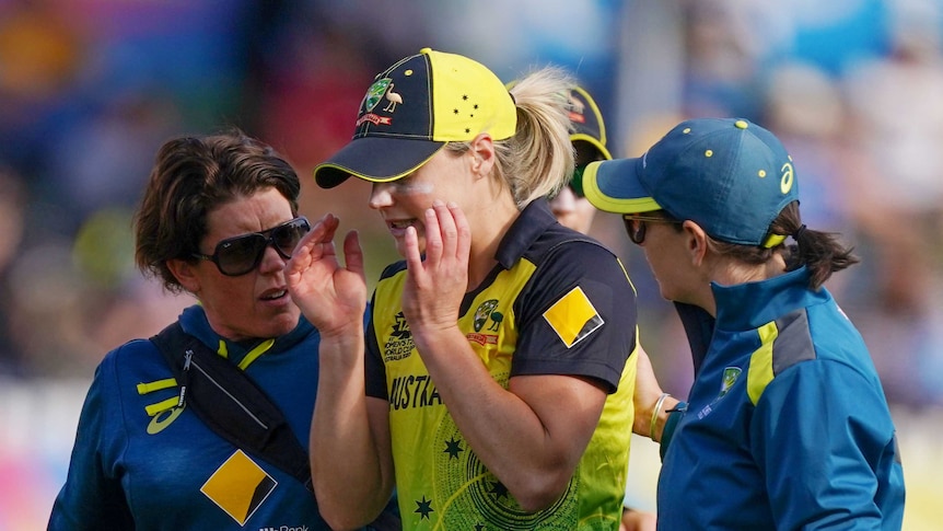 Ellyse Perry walks off in tears with her hands either side of her head