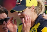 Ellyse Perry walks off in tears with her hands either side of her head