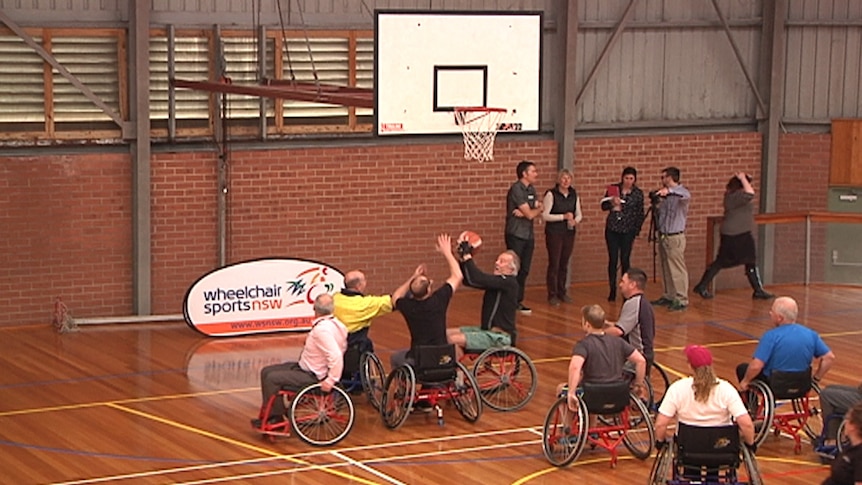 Gary Pearse attempts a pass at a wheelchair basketball game hosted by Wheelchair Sports NSW  in Bermagui