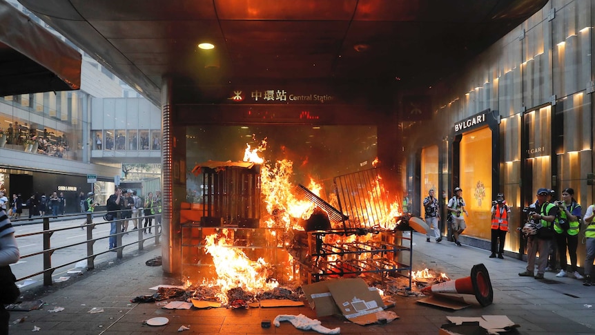 A fire burns at the entrance of central station in Hong Kong.