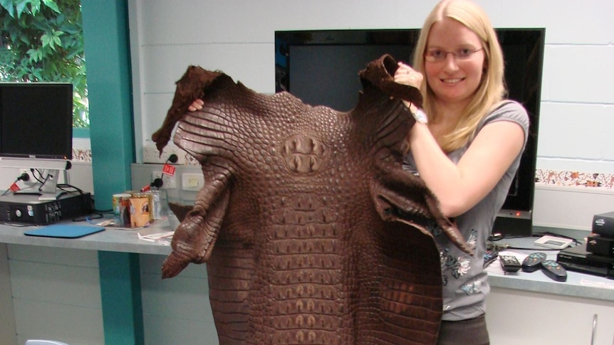Katherine School of the Air teacher Robyn Ison with the saltwater croc skin.