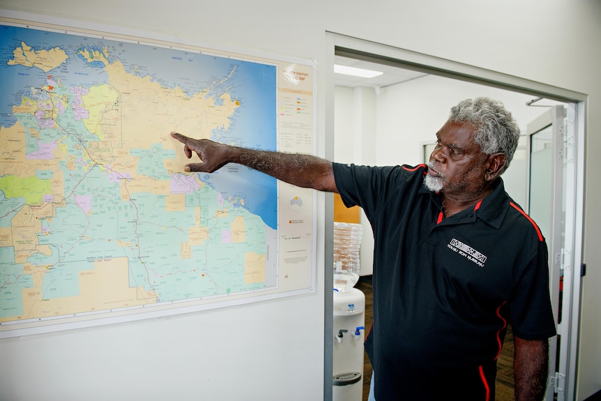 Yingiya Guyula points at a map.