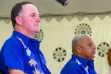New Zealand's Prime Minister John Key attends a welcome ceremony with his Fiji counterpart Frank Bainimarama in Suva