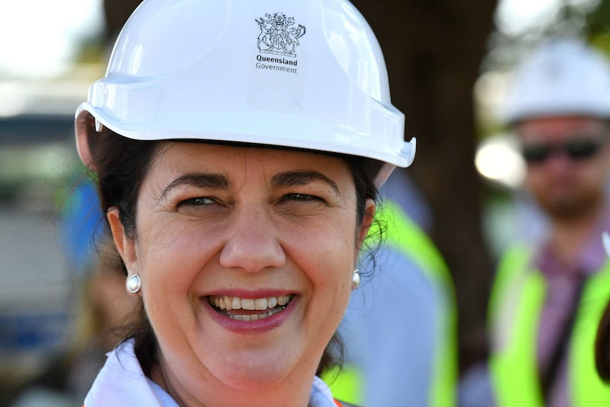 Premier Palasczuk wearing a hard hat, smiling.