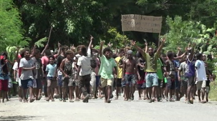 Solomon Islanders take to the streets to protest.