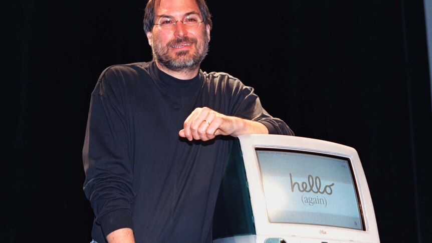 Apple CEO Steve Jobs stands by the new iMac computer as he addresses the Apple Expo in Paris September 17, 1998