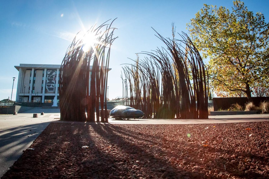 The sculpture Fire and Water stands in front of the National Library of Australia