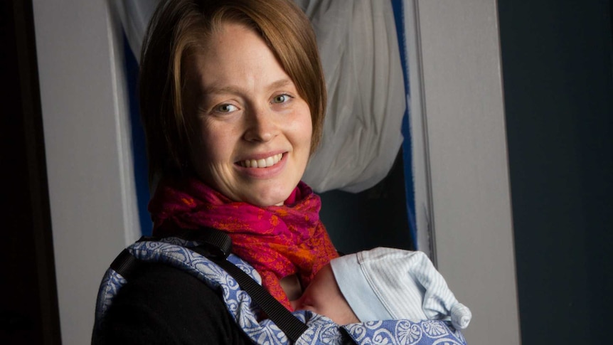 Stina Oftedal cradles her baby boy.