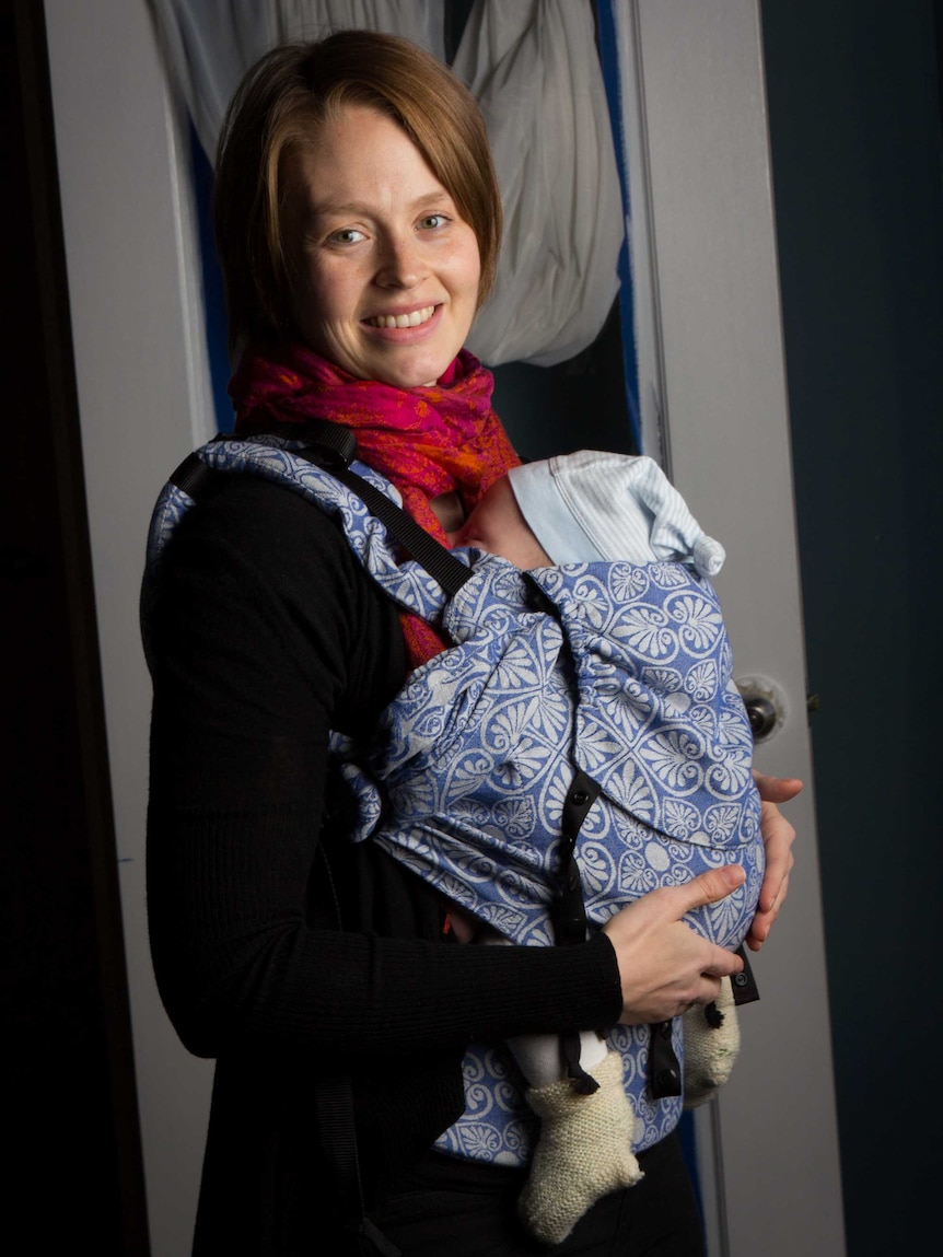 Stina Oftedal cradles her baby boy.