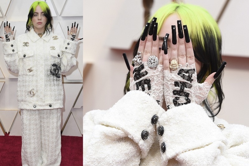 A composite of Billie Eilish wearing a white tweed suit with Chanel logos on it, green hair and long black nails.