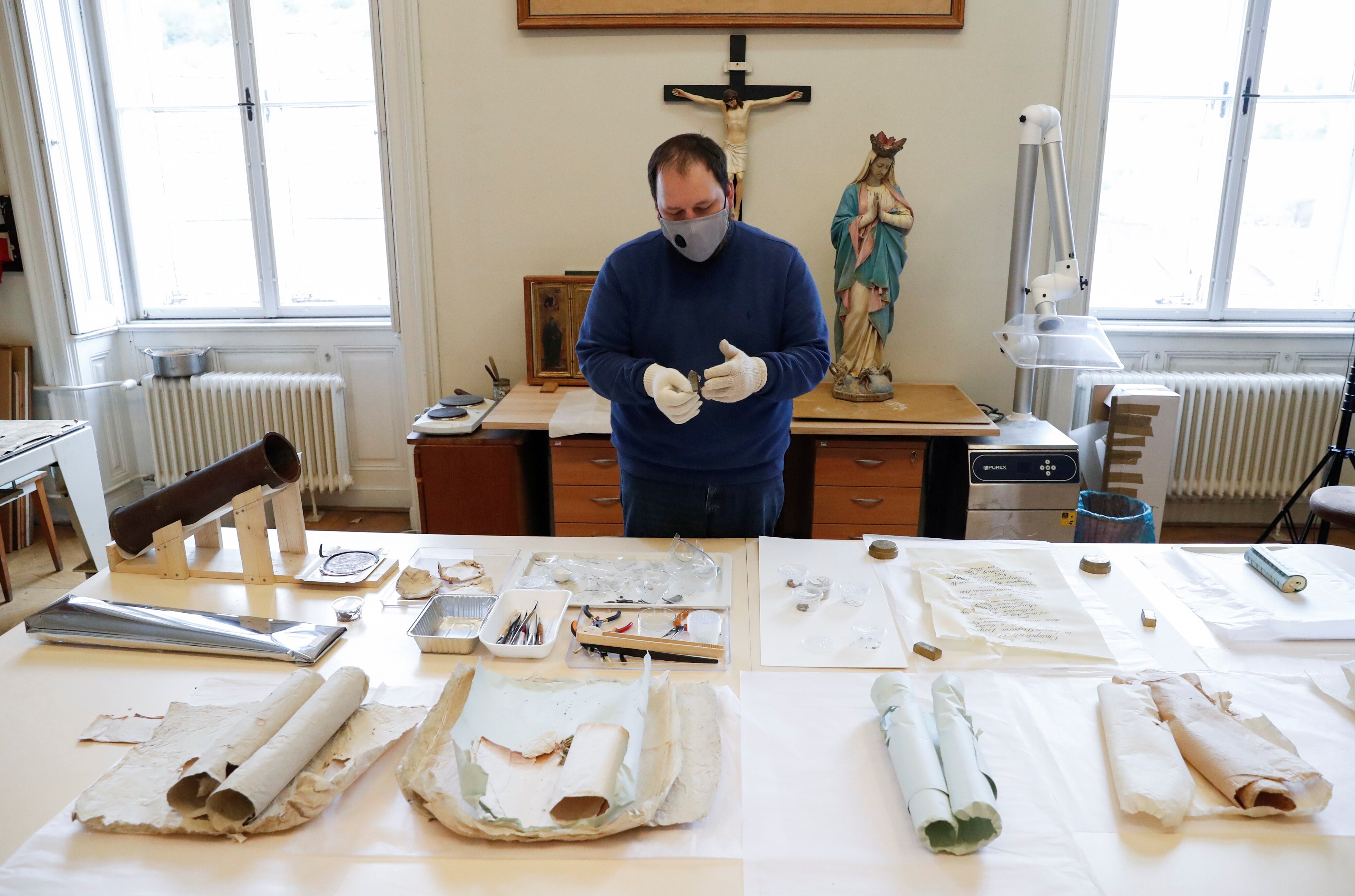 Paper items from the time capsule laid out on a table.