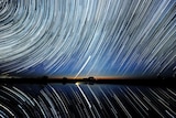 Star trails over Lake Tyrrell in the Mallee district of north-west Victoria with Chargee Gnowee (Venus) low on the horizon.