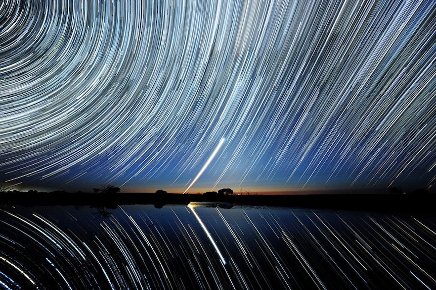 Star trails over Lake Tyrrell in the Mallee district of north-west Victoria with Chargee Gnowee (Venus) low on the horizon.