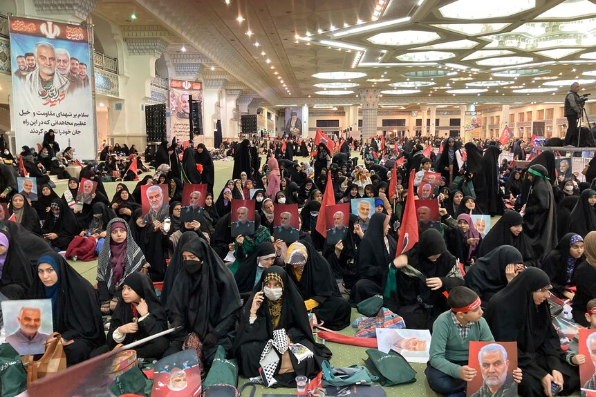 People attending a commemoration in Iran.