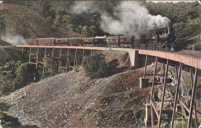 A train crosses the Sleep's viaduct in the Adelaide Hills puffing smoke