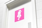 Toilet sign indicating woman needing to urinate.