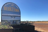 Welcome to Burketown sign on the side of a road