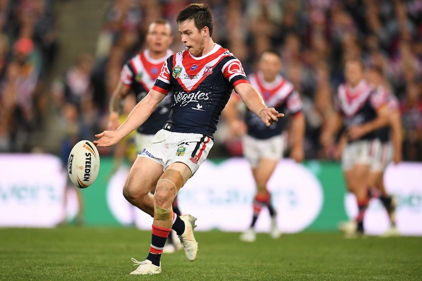 Luke Keary about to kick the ball on his right foot for the Sydney Roosters in the 2018 NRL grand final.