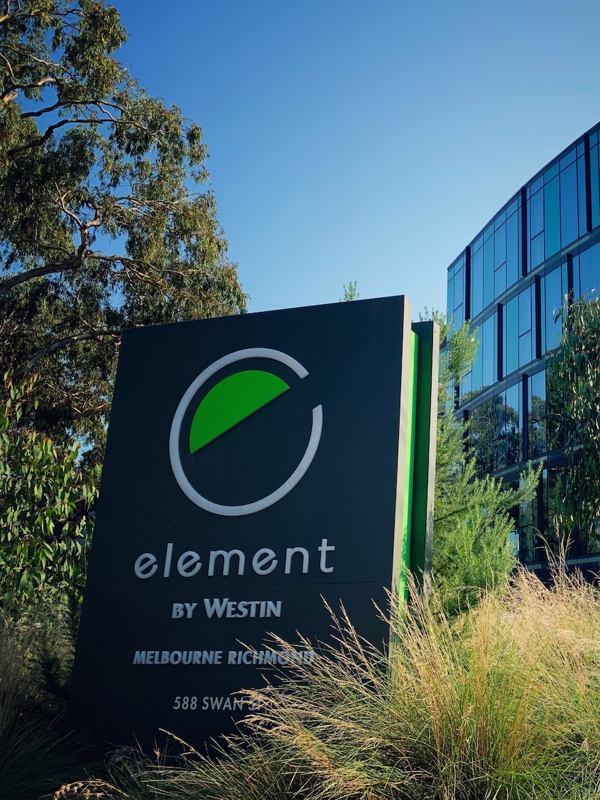 A sign saying Element by Westin with a modern multi-storey building in the background.