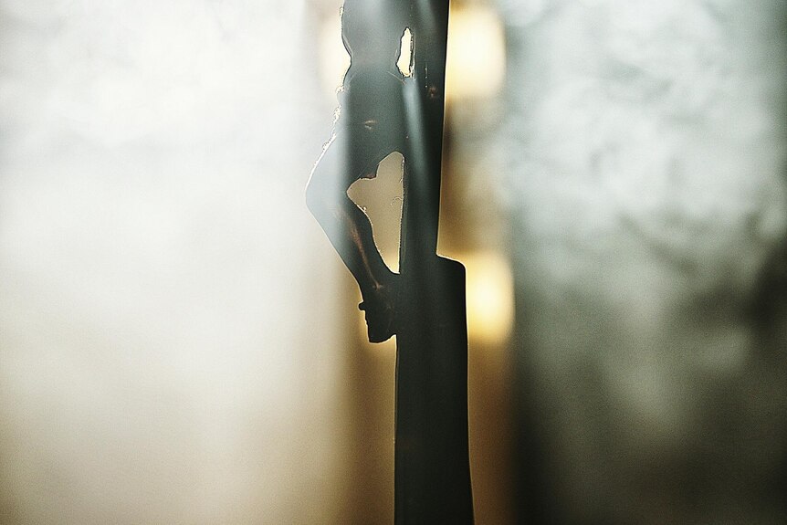 Crucifix shrouded in incense