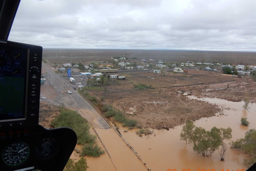 Queensland town of McKinlay cut off by flood waters, as seen from the air