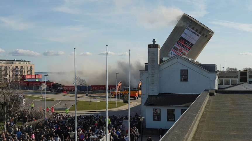 A silo demolition goes wrong, as it falls on the wrong side and lands in the local library in Denmark.