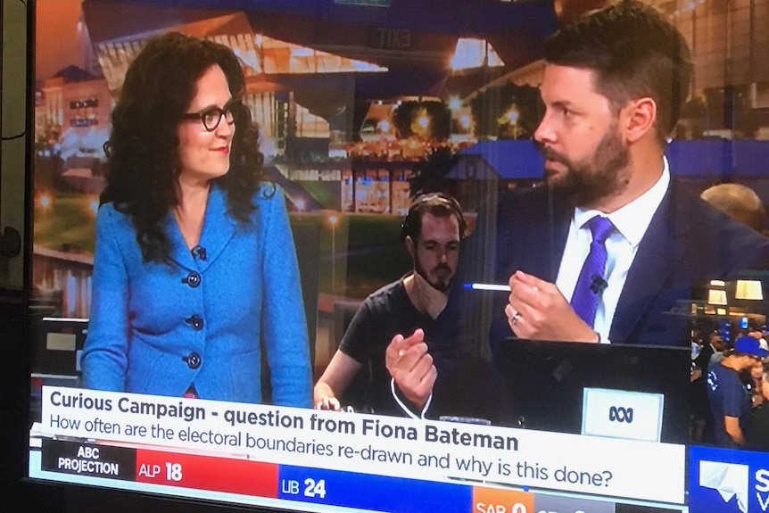 TV screen showing presenters Annabel Crabb and Nick Harmsen with Curious Campaign question in words at bottom.
